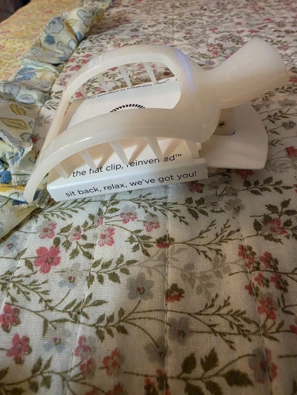 Coconut white plastic hair clip.